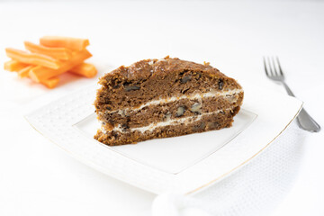 Slice of carrot cake and coffee on white background