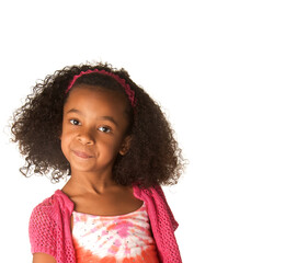 Little girl with beautiful curly frizzy hair  with funny puzzled expression on her face. 