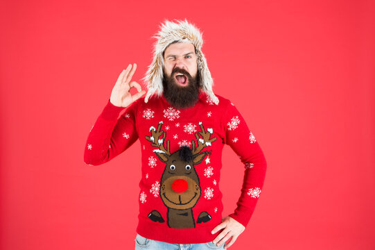 Loving cold weather. Christmas tradition. Christmas spirit and vibe. Happy new year. Join party. Winter outfit. Christmas sweater. Cheerful hipster bearded man wear christmas jumper and hat
