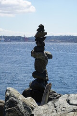 Stone overlap on the beach against the blue sky.