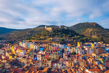 Aerial view of the beautiful village of Bosa with colored houses and a medieval castle. Bosa is...