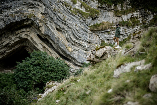 green landscape of mount in the pyrenees way to the cave of arpea