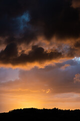 Fototapeta na wymiar Fantastic sunset with dark and colorful clouds.