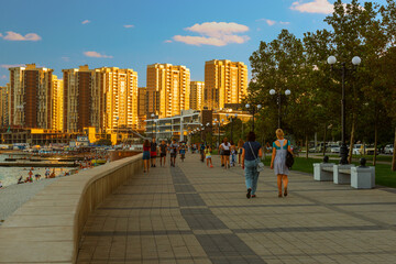 Urban landscape,the seaside promenade of the city in the evening before sunset