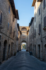 Fototapeta na wymiar Narrow alley in tuscan village. antique italian lane, Tuscany, Italy