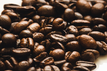 Roasted coffee beans background. international day of coffee. Close up. Selective focus..