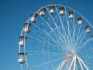 ferris wheel against blue sky