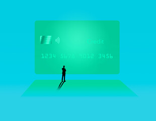 A silhouetted man stands in front of a huge image of a generic credit card on a movie screeen in this illustration. © Rob Goebel
