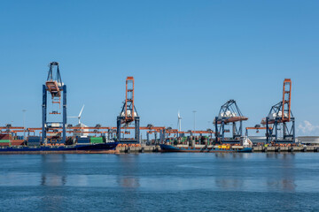 Container ships moored at a container terminal in the Port of Rotterdam. The port is the Europ's largest and facilitate the needs of a hinterland