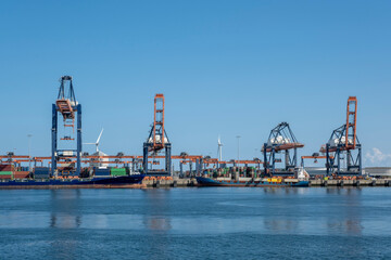 Container ships moored at a container terminal in the Port of Rotterdam. The port is the Europ's...