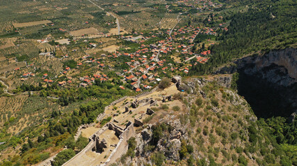 Aerial drone photo of medieval byzantine old city of Mystras featuring Monastery of Pantanassa, Temple of Agia Sofia and uphill castle of Mystras, Sparta, Peloponnese, Greece