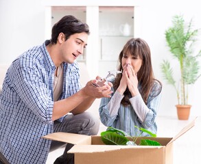 Young family moving in to new apartment after paying off mortgag