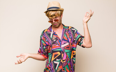 blonde adult traveller manshrugging with a dumb, crazy, confused, puzzled expression, feeling...