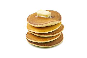 Stack of pancakes with butter piece on white
