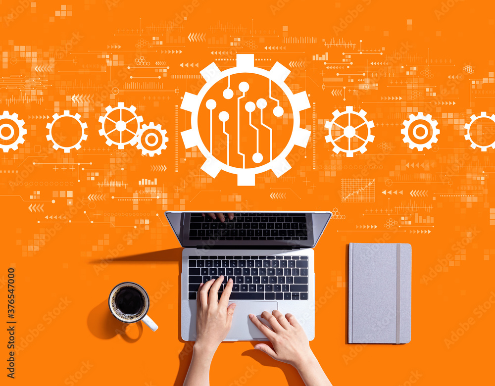Poster automation concept with person using a laptop computer