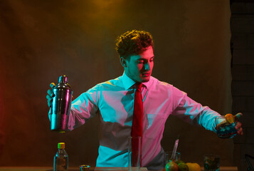 Barman preparing drink with shaker