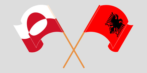 Crossed and waving flags of Greenland and Albania