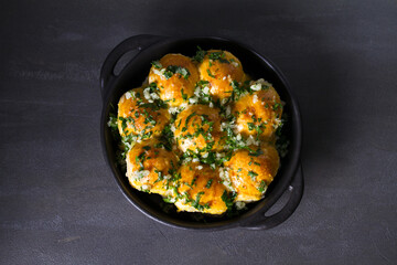 Buns Pampushky - Ukrainian garlic bread. Bread rolls with garlic and parsley. View from above, top studio shot