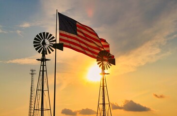 windmill and American flag at sunset