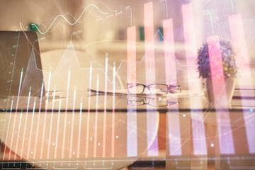 Double exposure of financial graph drawing and office interior background. Concept of stock market.