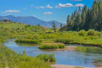 The peaceful flowing of the Snake River in the Rocky Mountains of Wyoming