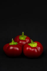 red peppers and black background
