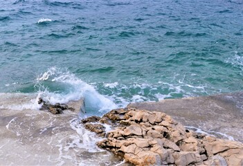 Blue sea and stone with water water splash