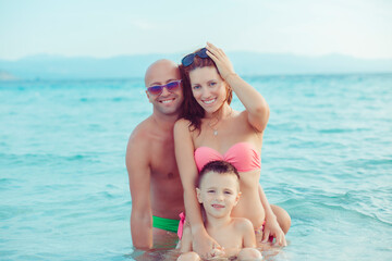Happy family on the oceanfront, outdoors