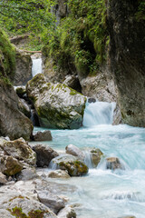 Beautiful mountain stream flowing through rocks and stones