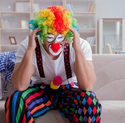 The drunk clown celebrating having a party at home
