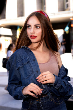 Fototapeta beautiful girl model in denim with red lipstick