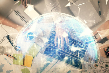 Double exposure of man and woman working together and business theme hologram drawing. Computer background. Top View.