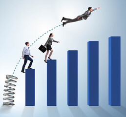 Business people jumping over bar charts