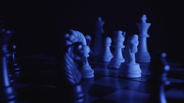 Chess pieces on a chessboard in a colorful fashion style. Blue colors, flash strobe effect. Ambulance concept, deadline, danger, fashion, business. Depth of field, soft focus. Red camera, 4K