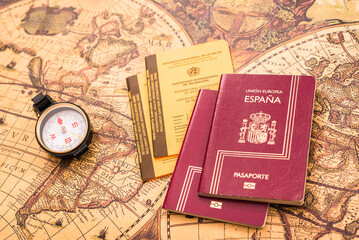 Valencia, Spain - September 6, 2020: Spanish passport next to the international vaccination card