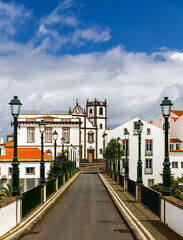 Fototapeta na wymiar View of Nordeste on Sao Miguel Island, Azores. Old stone arch bridge in Nordeste village, Sao Miguel, Azores. Nordeste village with white town buildings on the island of Sao Miguel, Azores, Portugal.