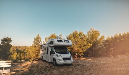 campervan caravan vehicle for van life holiday on mobile home camper mobile motor home RV campervan for an outdoor nomad lifestyle camper van journey camping in the parking in the forest - obrazy, fototapety, plakaty