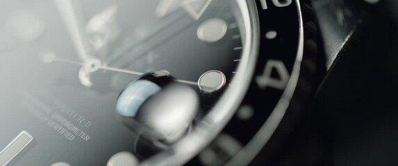 Macro shot of si, er watch ticking