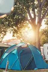 Travelers expedition hipster holiday camping journey. Nothing that makes you feel more free than camping with tent. Sleeping close to ground, woken up by sunshine and hearing beautiful songs of nature