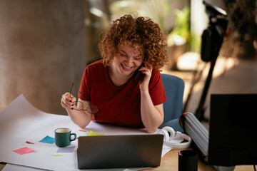 Beautiful businesswoman working on projects. Young businesswoman talking to the phone