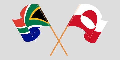 Crossed and waving flags of Greenland and Republic of South Africa