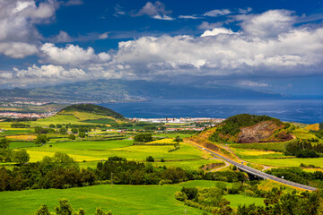 Azores panoramic view of natural landscape, wonderful scenic island of Portugal. Beautiful lagoons in volcanic craters and green fields. Tourist attraction and travel destination. Azores, Portugal.