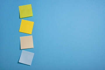 bright colored sticky notes on blue background