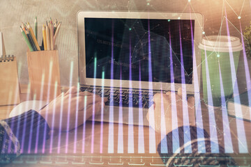 Double exposure of woman hands typing on computer and forex chart hologram drawing. Stock market...