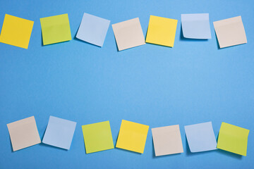 bright colored sticky notes on blue background