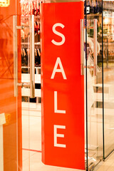 Red counter with "Sale" sign.
