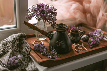 Still life with chocolate, lemons and lilac