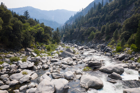 The scenic Feather River flows through a canyon in Northern California' Sierra Nevada Mountains. This beautiful flow of water is the principal tributary to the Sacramento River.