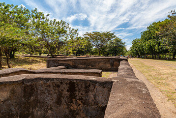 Leon, Nicaragua - November 27, 2008: Ruins of old Leon. Line of  brick wall squares being the...