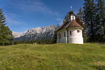 Fototapeta na wymiar view on karwendel mountains and the chapel maria koenigin (queen maria), bavaria, germany
